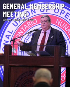 793 Business Manager Mike Gallagher standing at a podium giving a speech