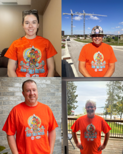 793 staff wearing orange shirts