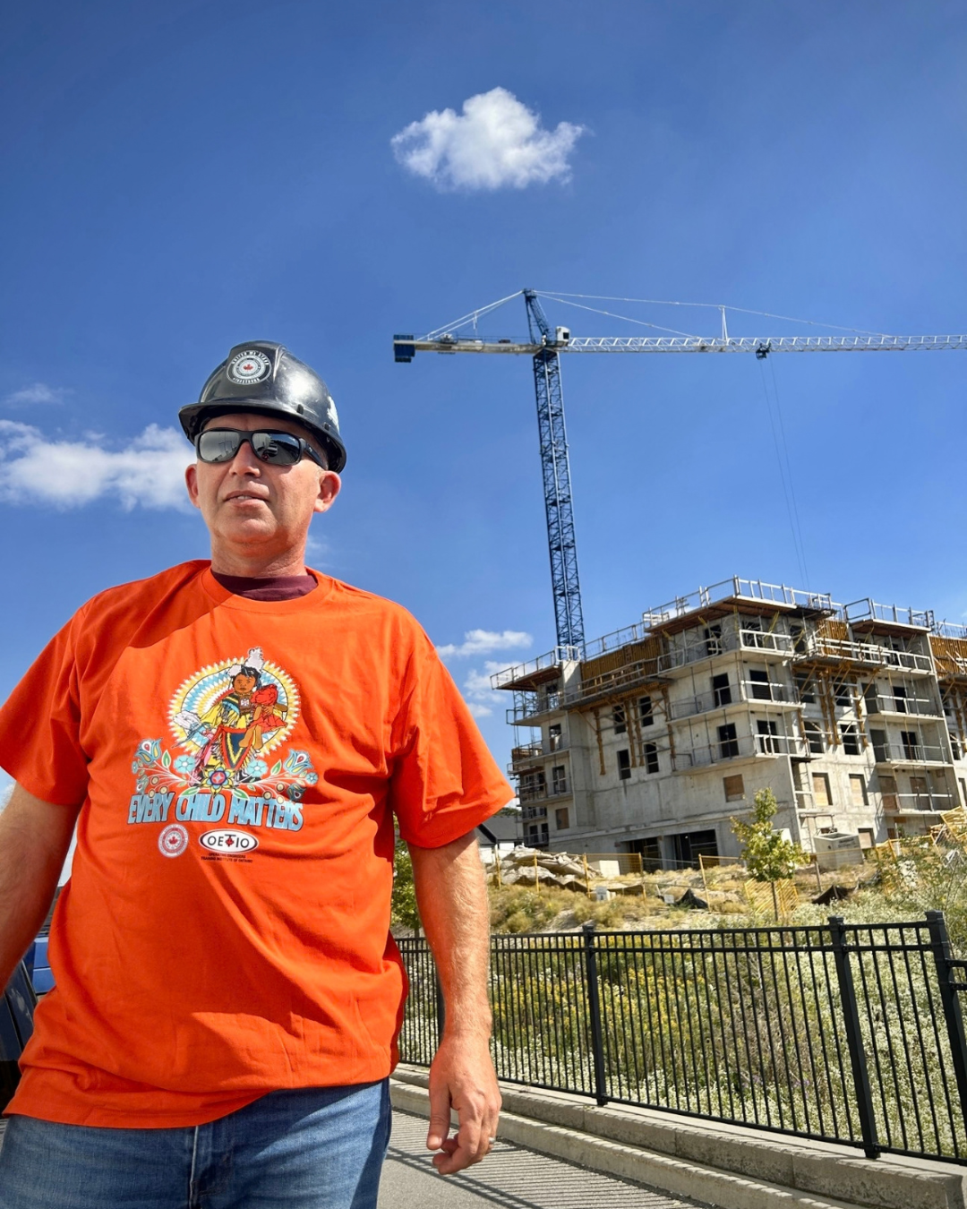 793 staff member wearing an orange shirt