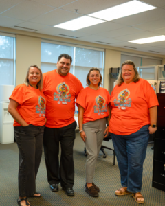 793 staff wearing orange shrits