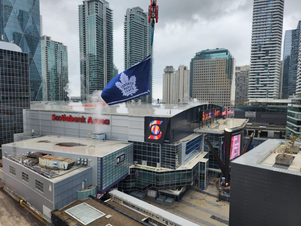 Wide shot of the Scotiabank Arena with a Toronto Maple Leafs flags flying