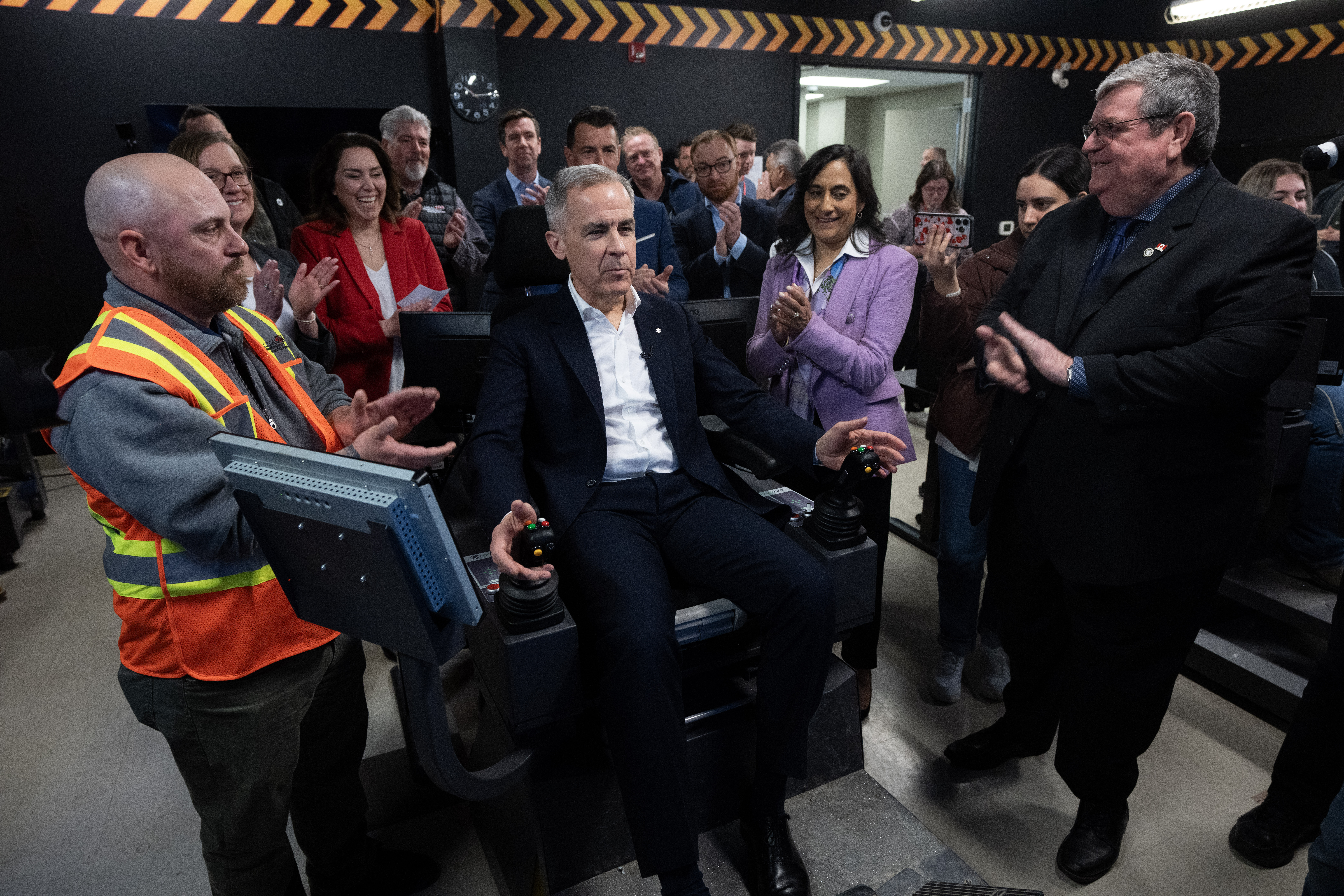 Prime Minister Mark Carney on a HEO Simulator