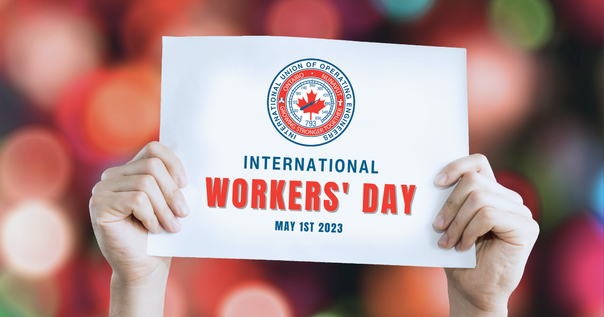 Image of hands holding a sign that reads 'International Workers' Day, May 1st 2023' with IUOE Local 793 logo