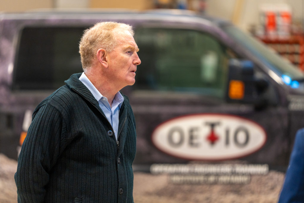 Skilled Trades Ontario Chair, Michael Sherrard listening in front of OETIO truck
