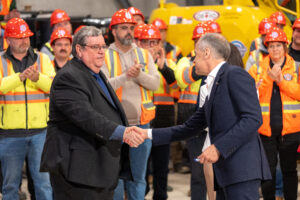 Prime Minister Mark Carney with Business Manager Mike Gallagher Shaking Hands