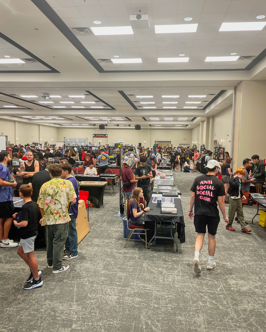 The 2026 Card Yard Event, multiple booths in a large room with multiple people walking around in the image