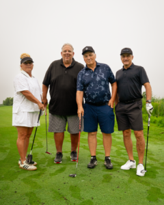 4 IUOE 793 members standing side by side on a golf course.
