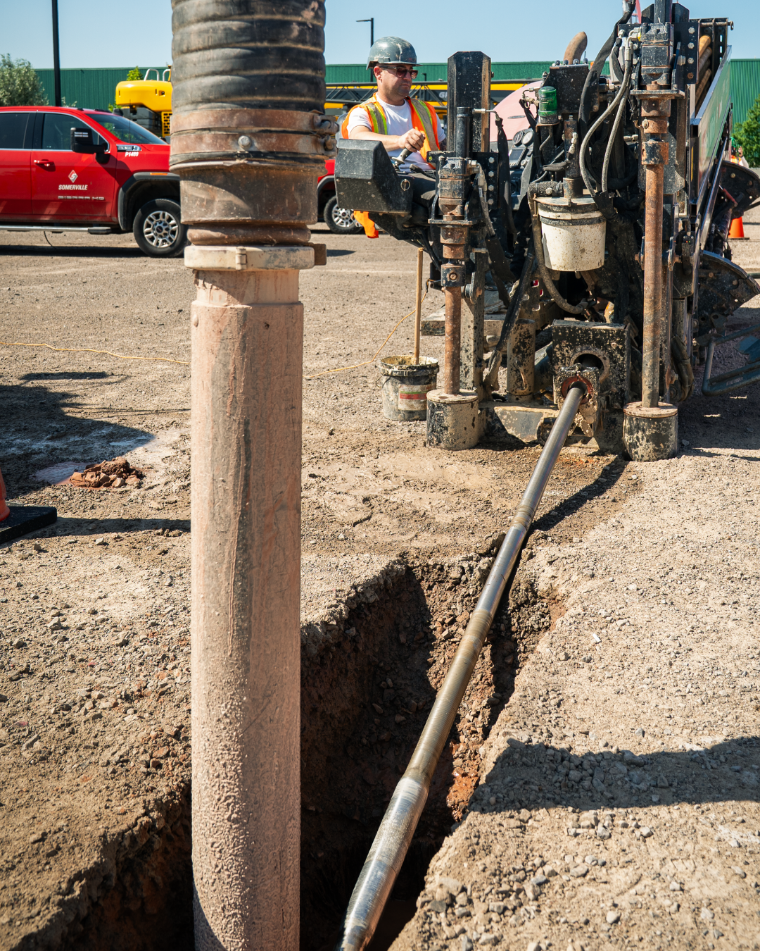 A whole in the ground with pipes running into it