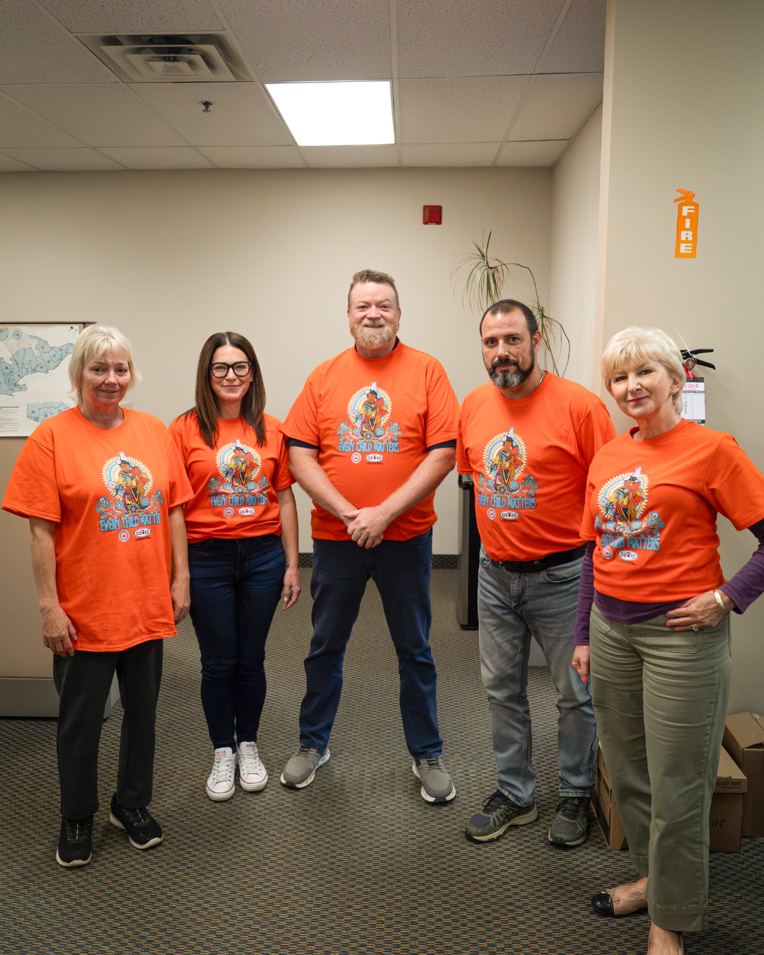 793 staff wearing orange shirts
