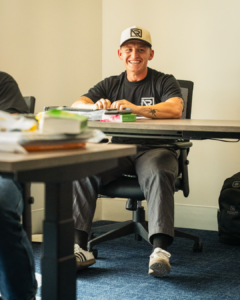 A student smiling in class.
