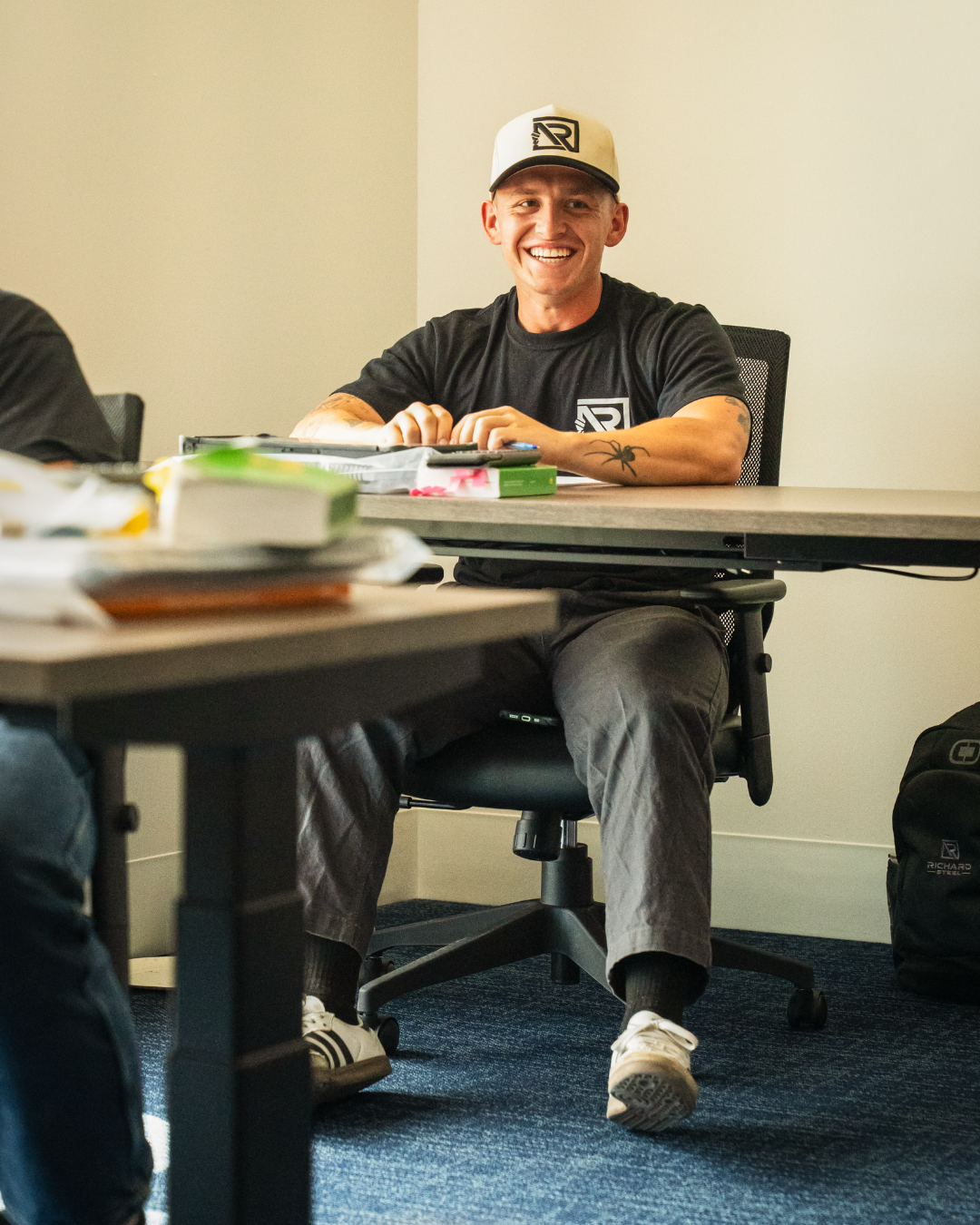 A student smiling in class.