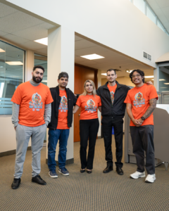 793 staff wearing orange shirts
