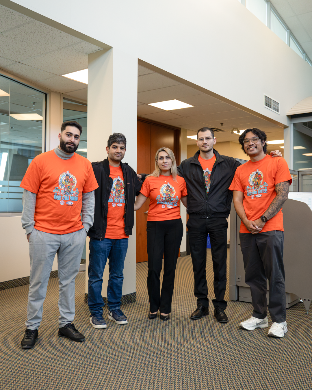 793 staff wearing orange shirts