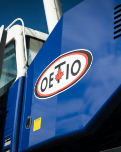 Part of a machine with the OETIO logo on it.
