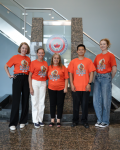 793 staff wearing orange shirts
