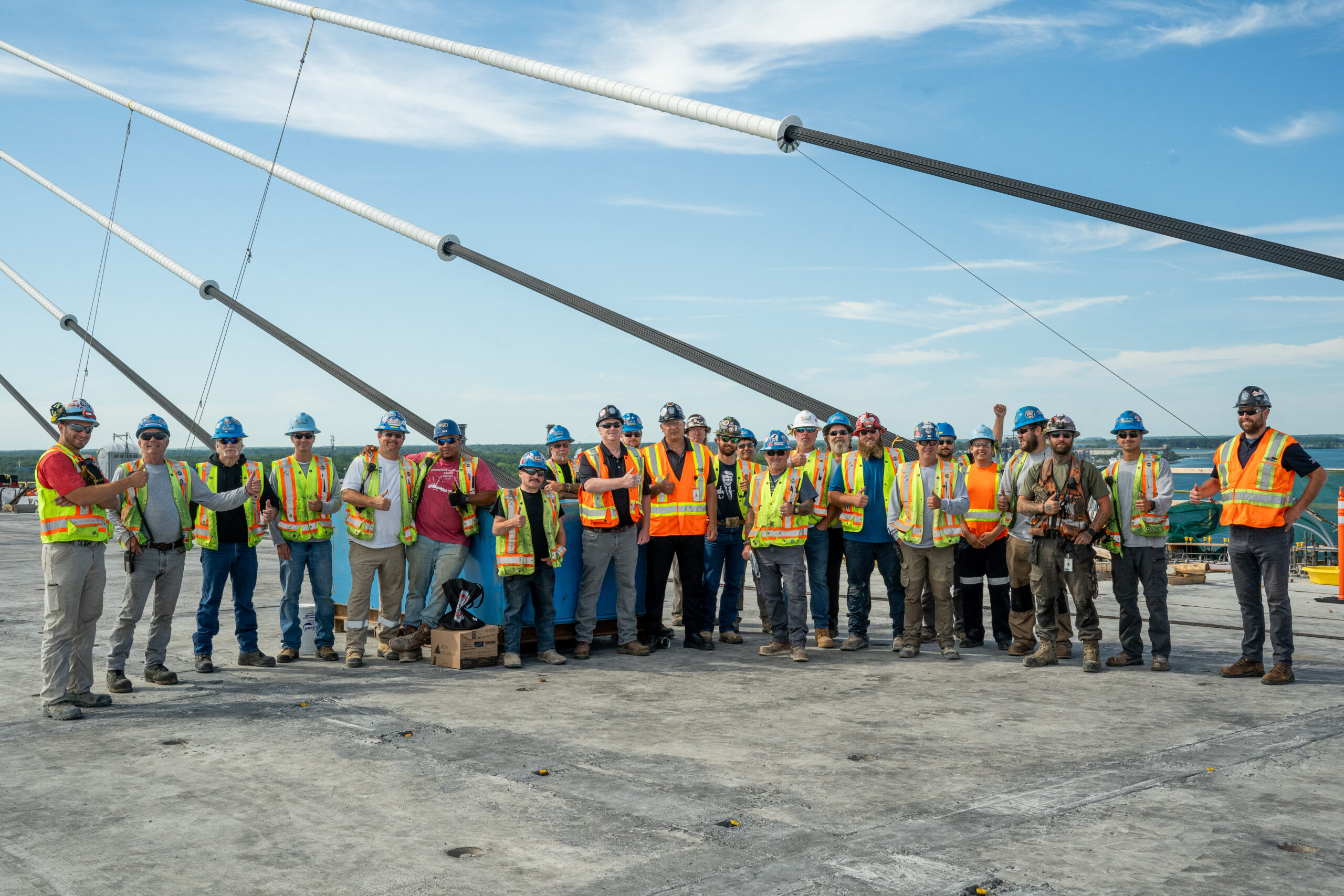 Local 793 President Dave Turple and Local 793 Recording-Corresponding Secretary and Southwestern Ontario Supervisor Steve Booze (centre) stand alongside some of the hundreds of Local 793 members that are helping build the Gordie Howe International Bridge.