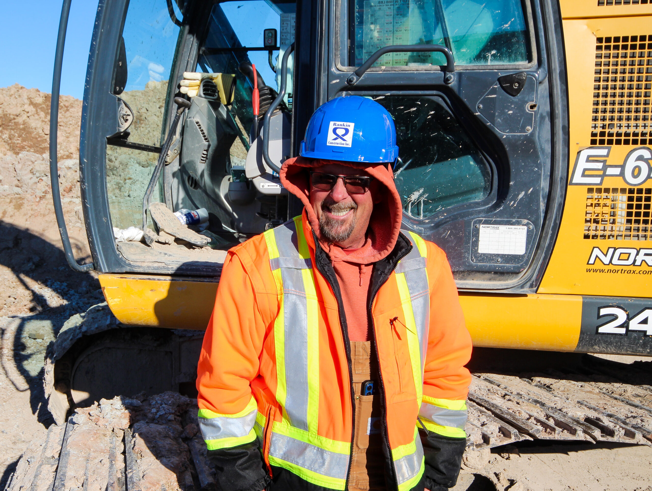 Chris De Mooy operates a John Deere 245G mid-size excavator working on the car park and maintenance areas of the hospital.