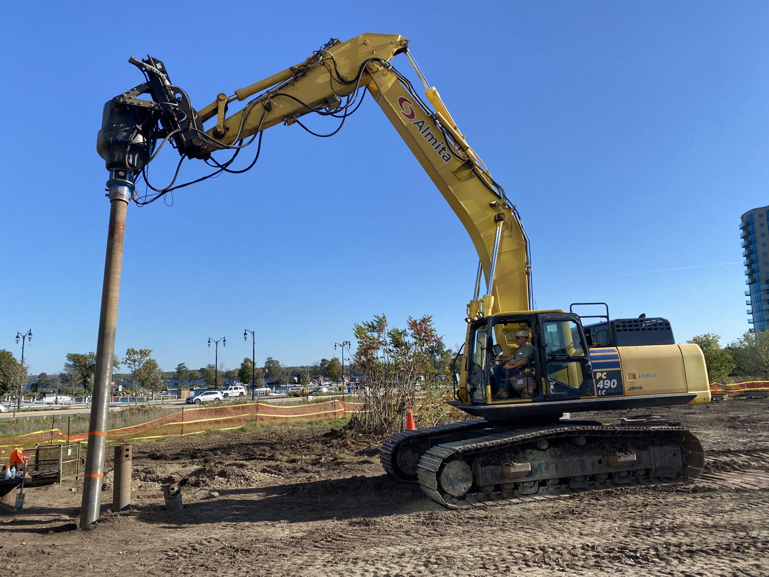 Local 793 member Mark Abrams operating a Komatsu PC 490 excavator with a drill head.