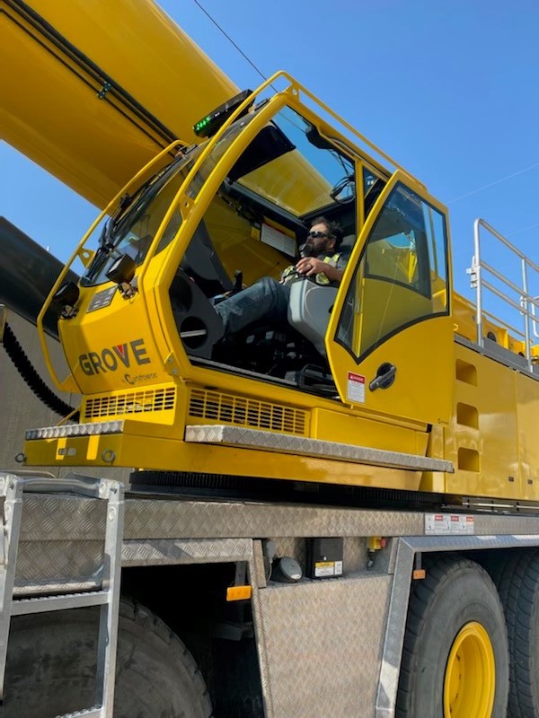 Member inside the operating cab of the excavator