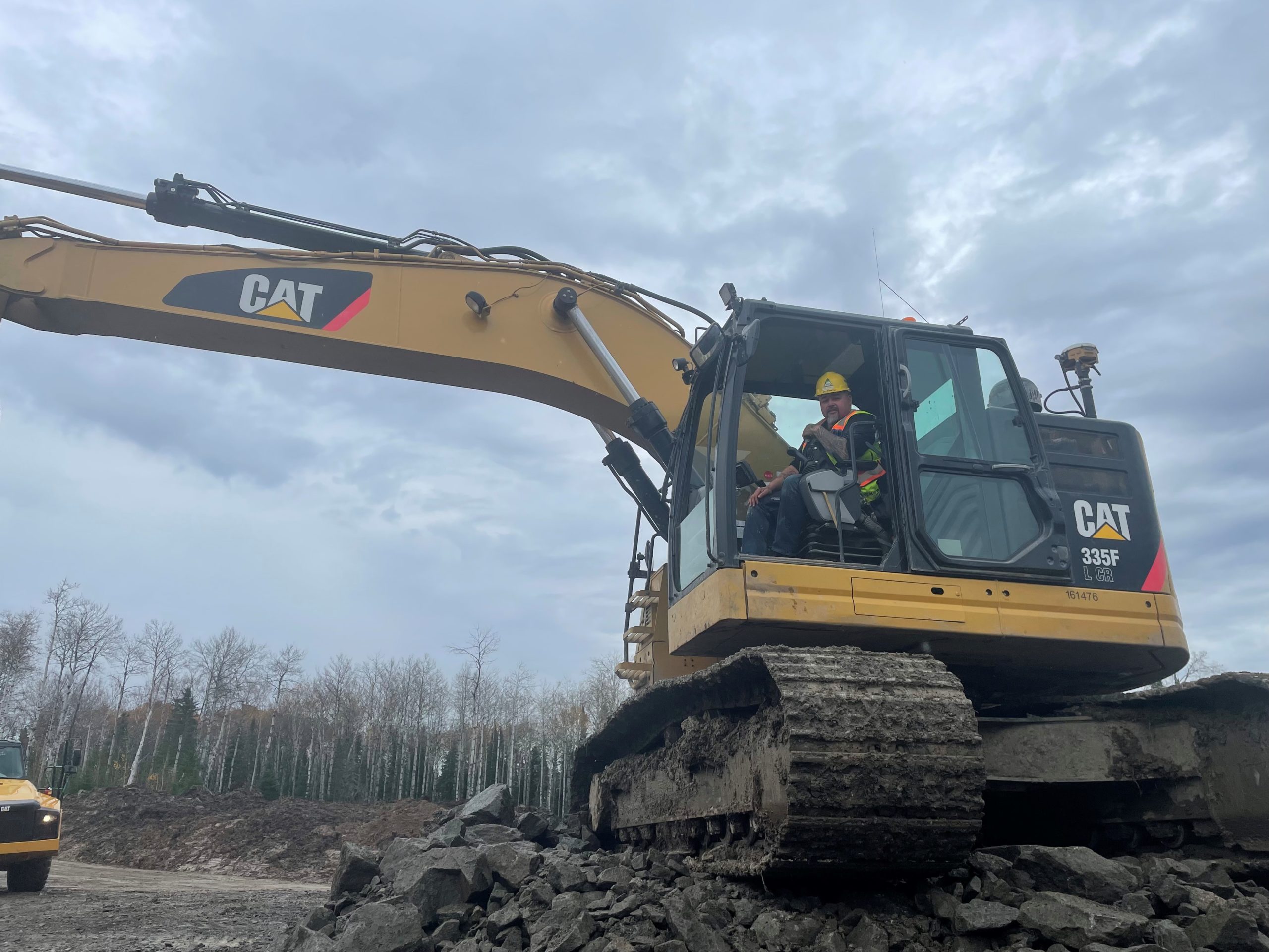 Real Levesque operating a 335F excavator.