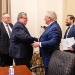 Ford & Piccini Meeting - Button