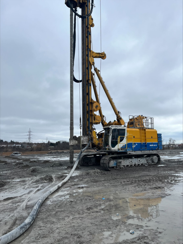 Wide shot of a Bauer BG 30- Rotary Drilling Rig