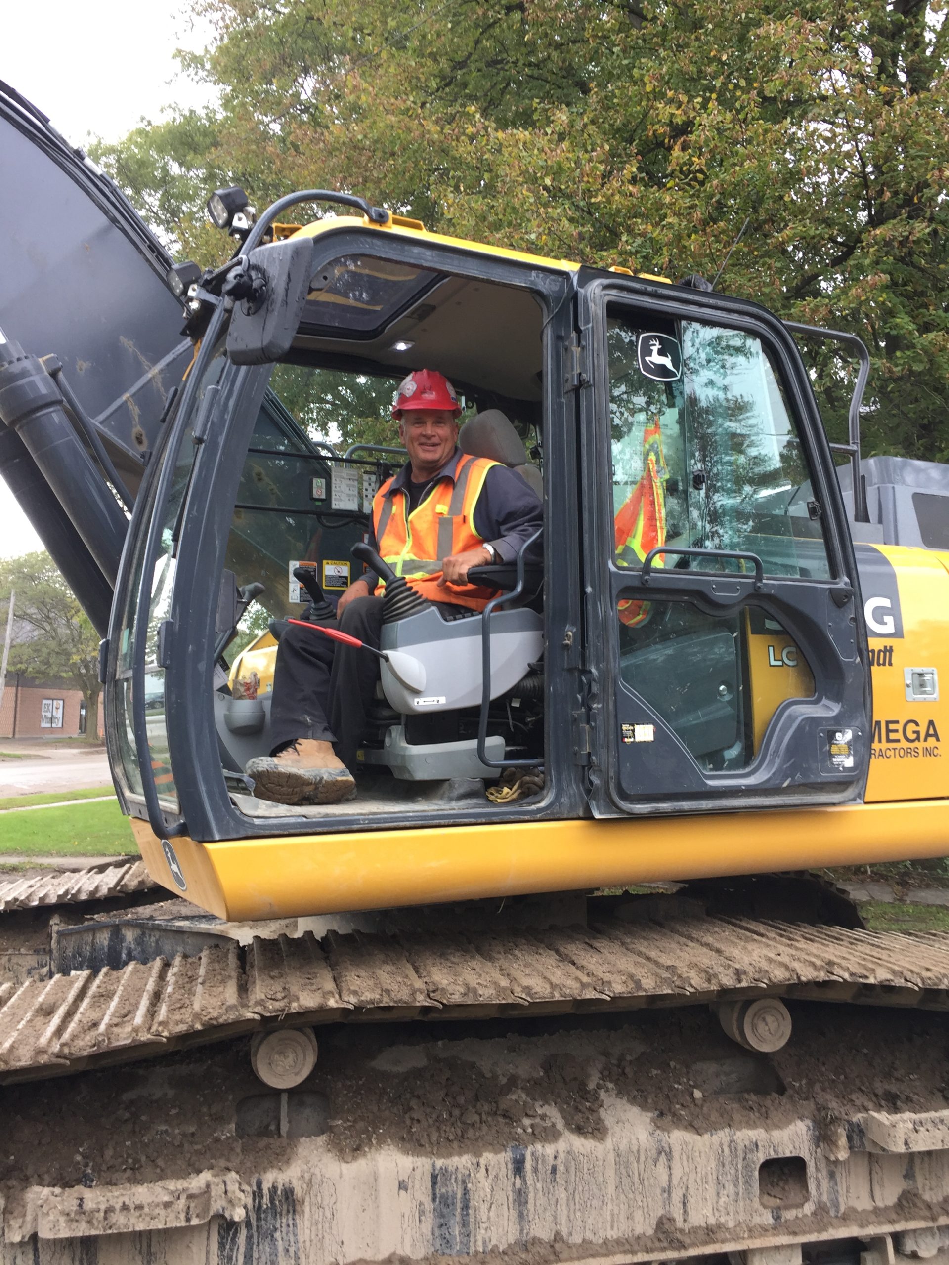 Rob Scott is operating a John Deere 300G excavator.