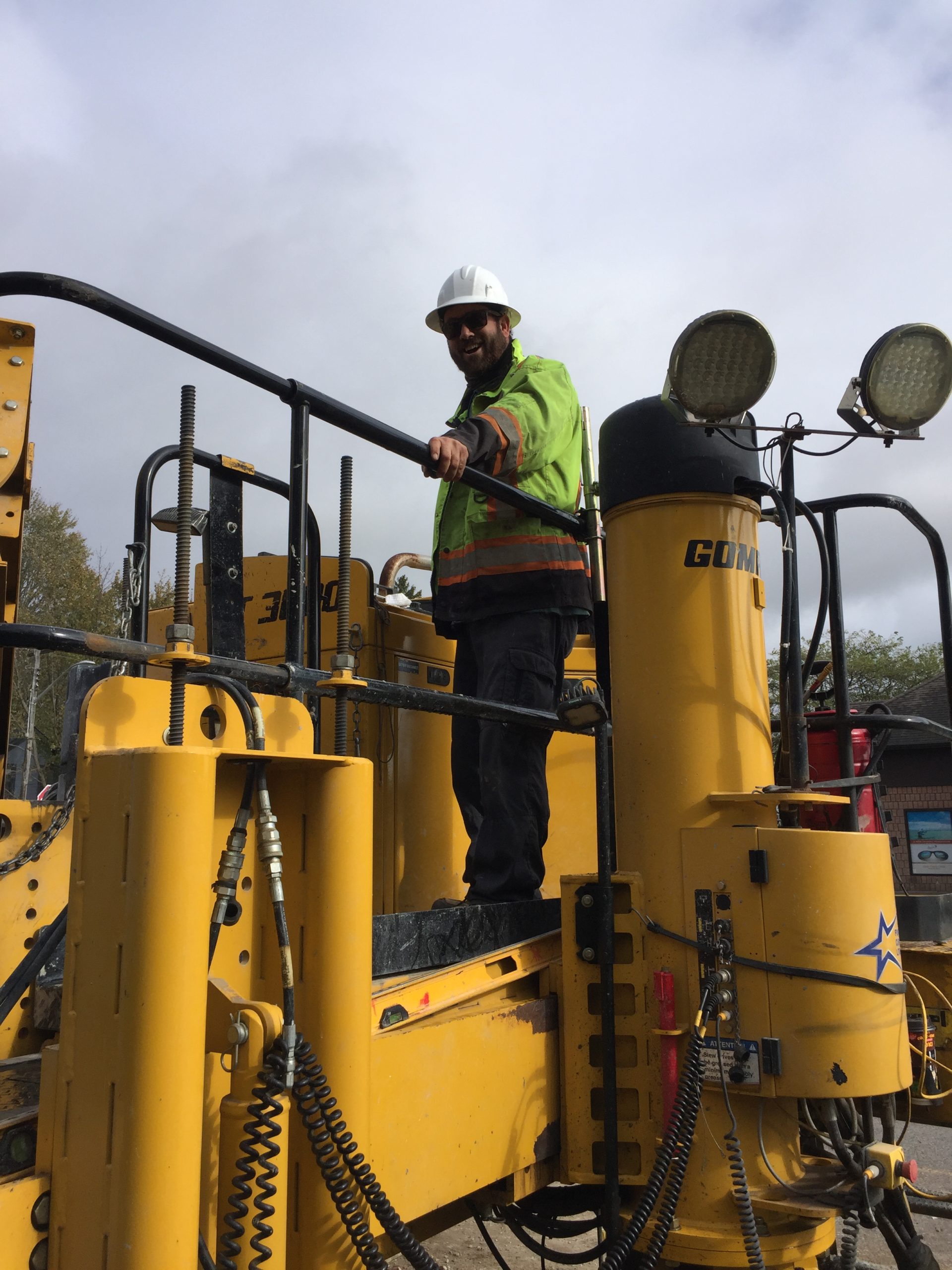 Louie Fortese is operating a Gomaco GT-3600 curb and gutter machine.