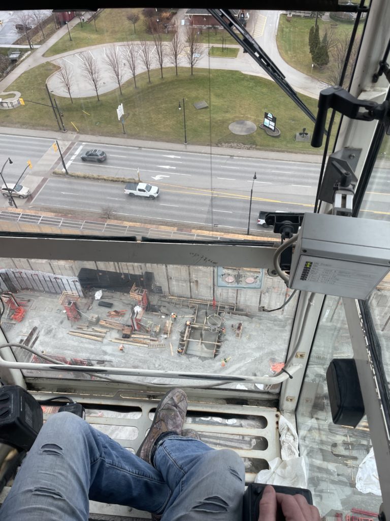 Members view from inside the crane cab and the view down on the site