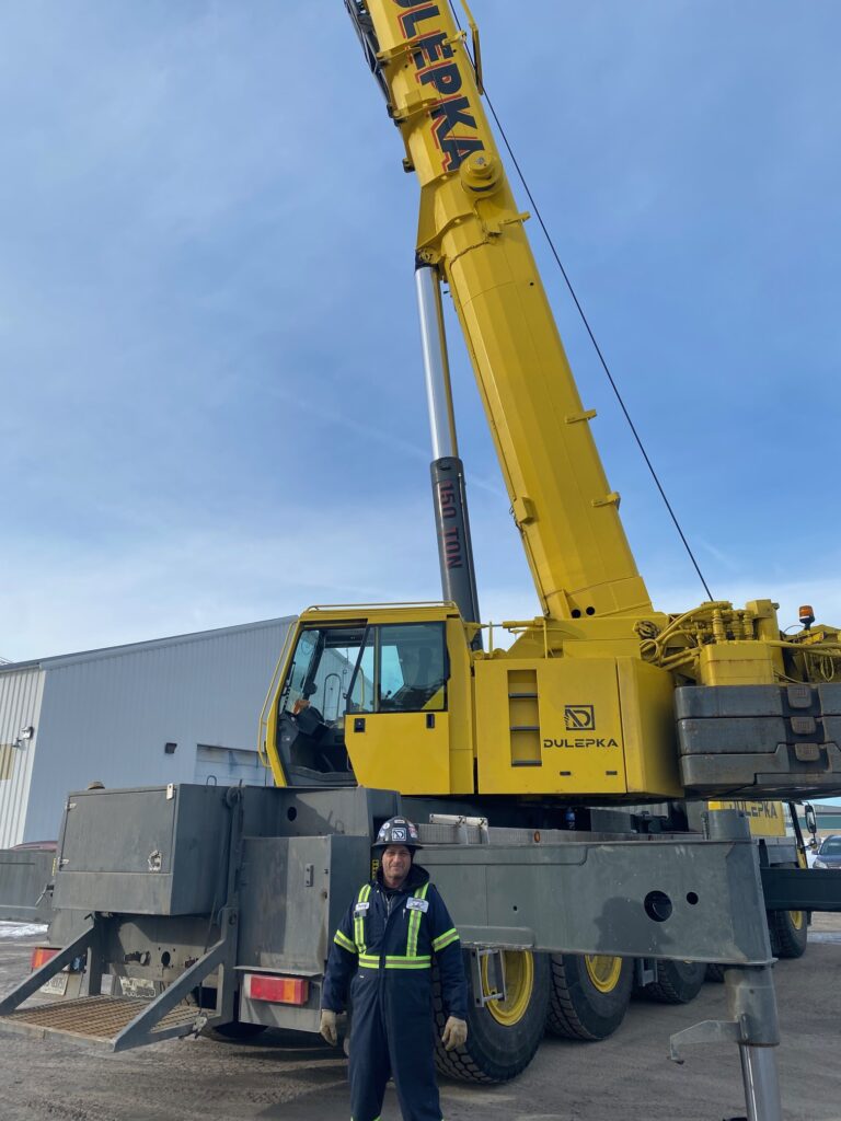 Member standing in front from a Liebherr LTM 112